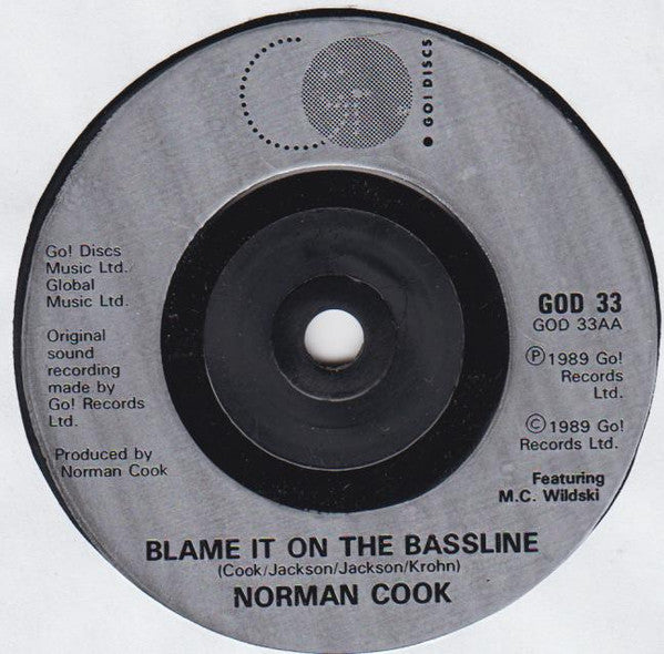 Norman Cook : Won't Talk About It / Blame It On The Bassline (7", Single, Sil)